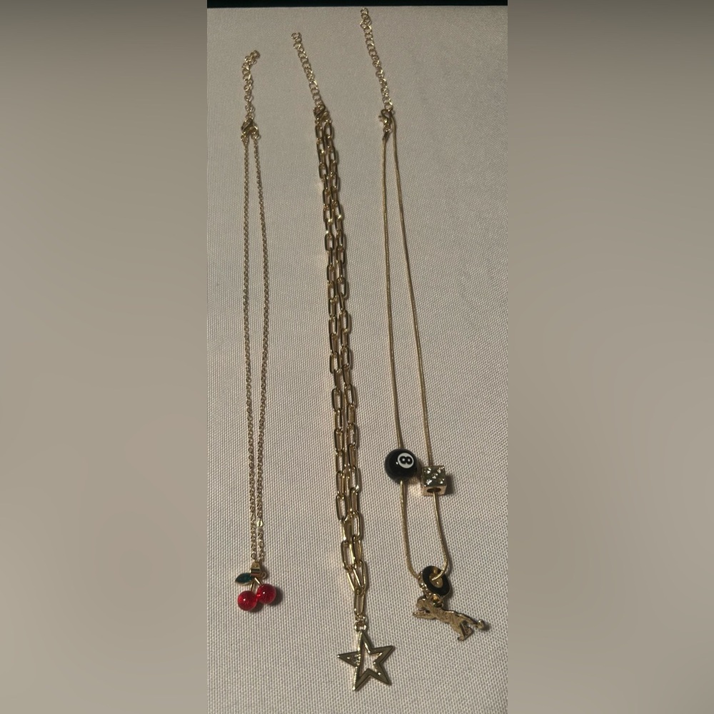 Gold-Tone Layered Charm Necklace Set with Star, Cherry, and 8-Ball Accents